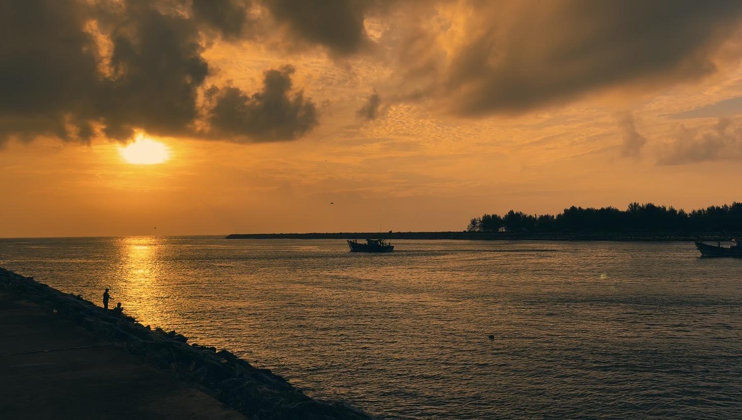 Coastal sunset over water